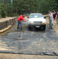 Prevent the spread of invasive plants by washing vehicles.