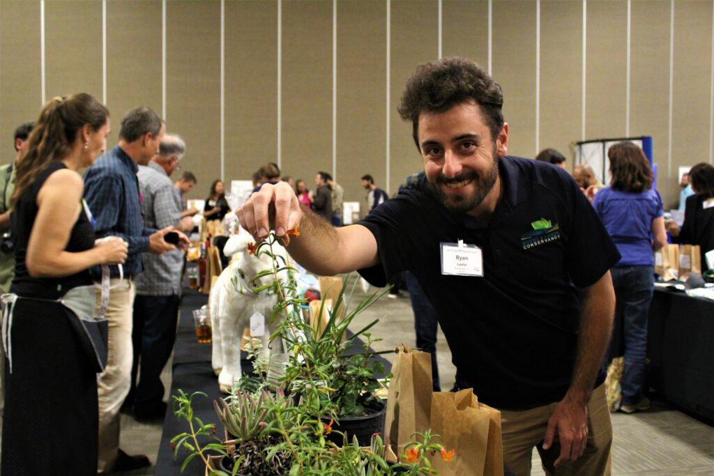 Attendees check out the goods at the 2019 Auction & Raffle. Photo: Claire F. Meyler