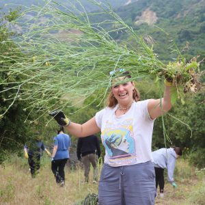 Volunteer holds up weed